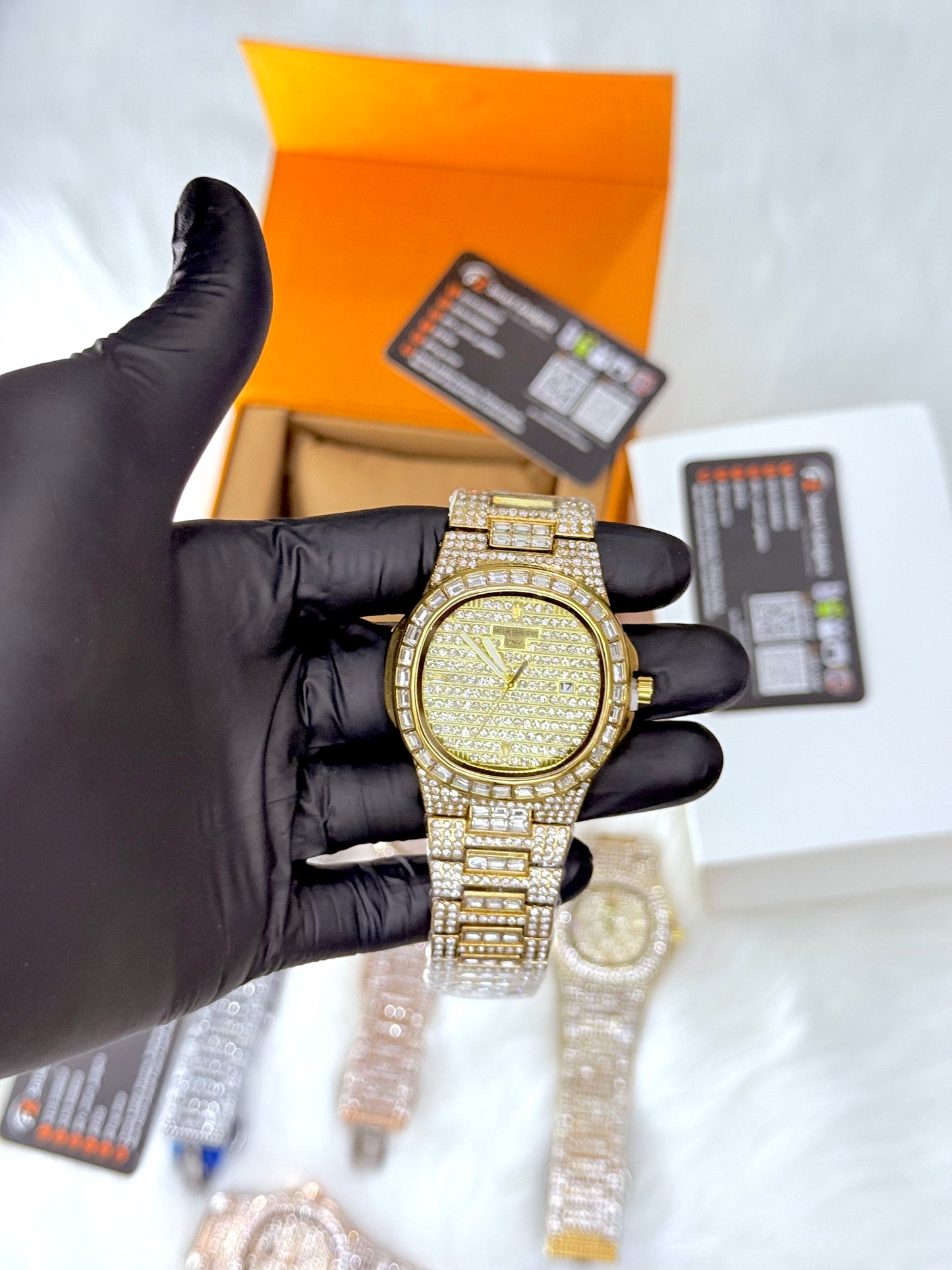 Patek Philippe iced out watch in gold with diamond-encrusted bracelet