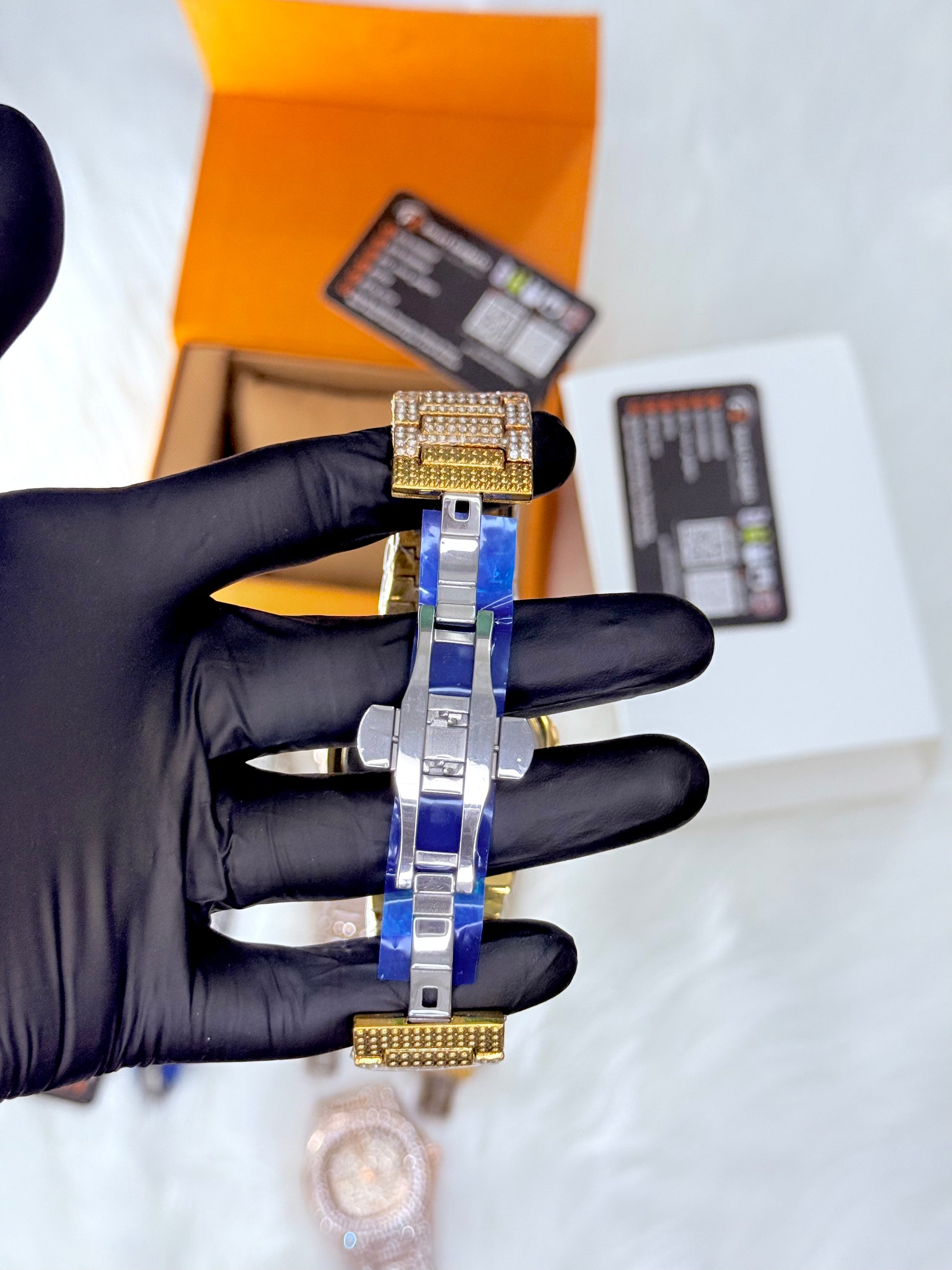 Patek Philippe  iced out watch in gold with master lock-encrusted bracelet