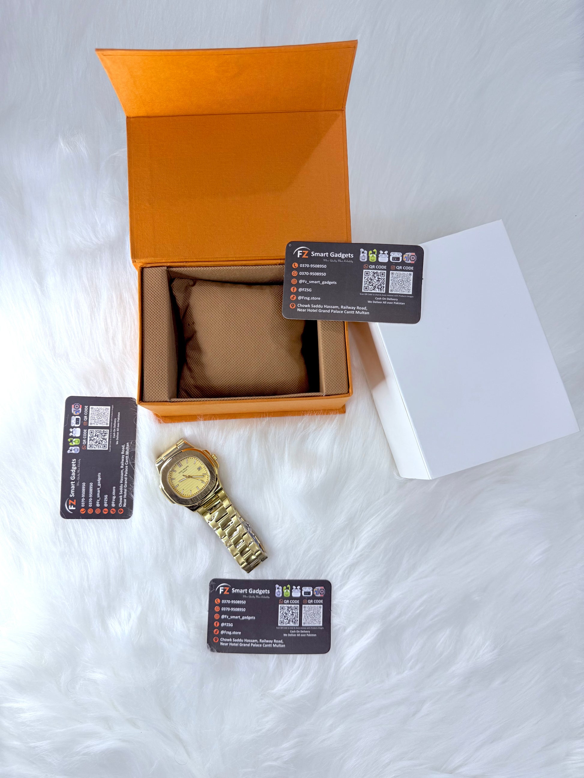 Patek Philippe Geneve watch with yellow dial and stainless steel chain