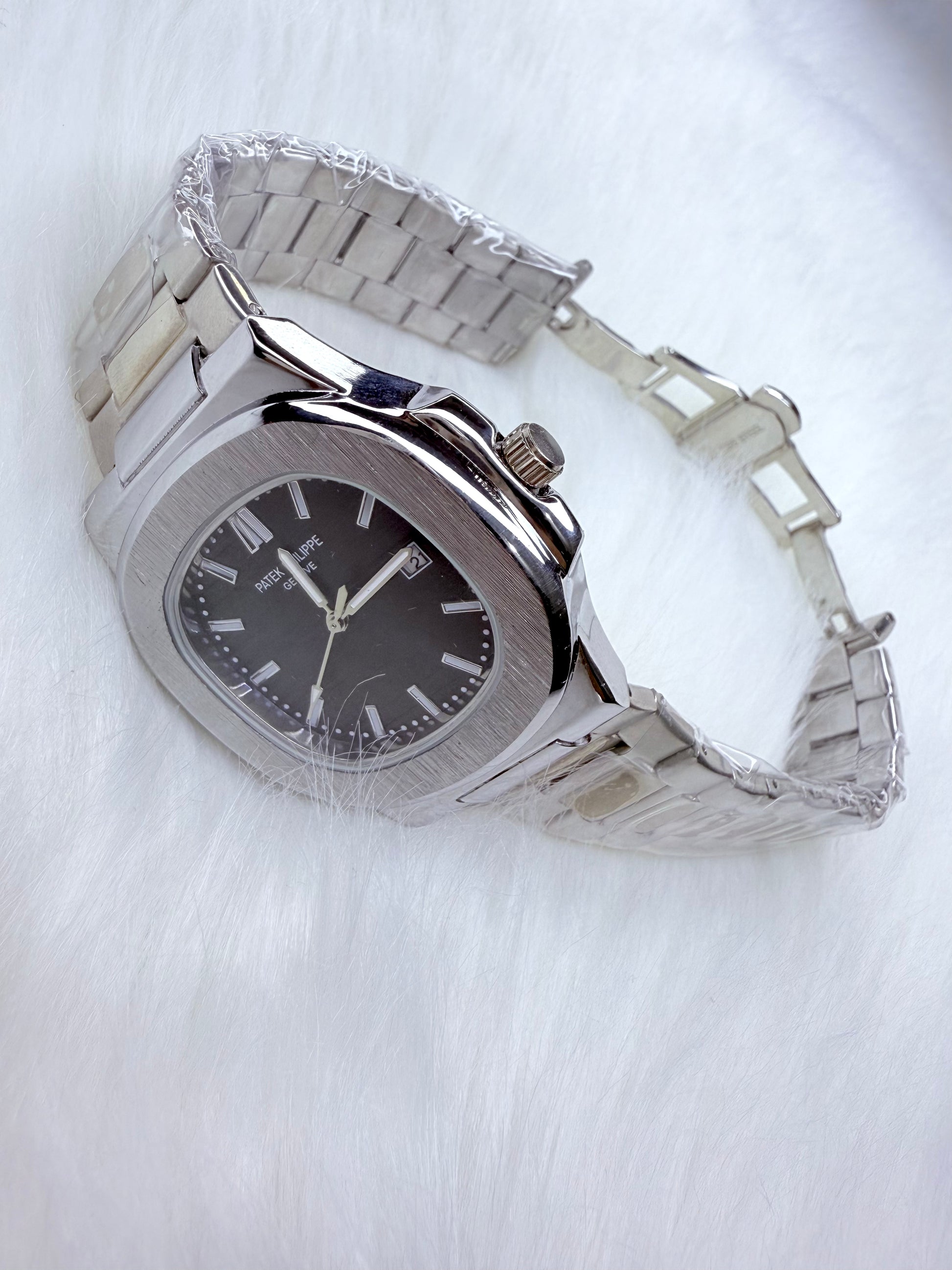 Patek Philippe Geneve watch with black dial and silver stainless steel bracelet