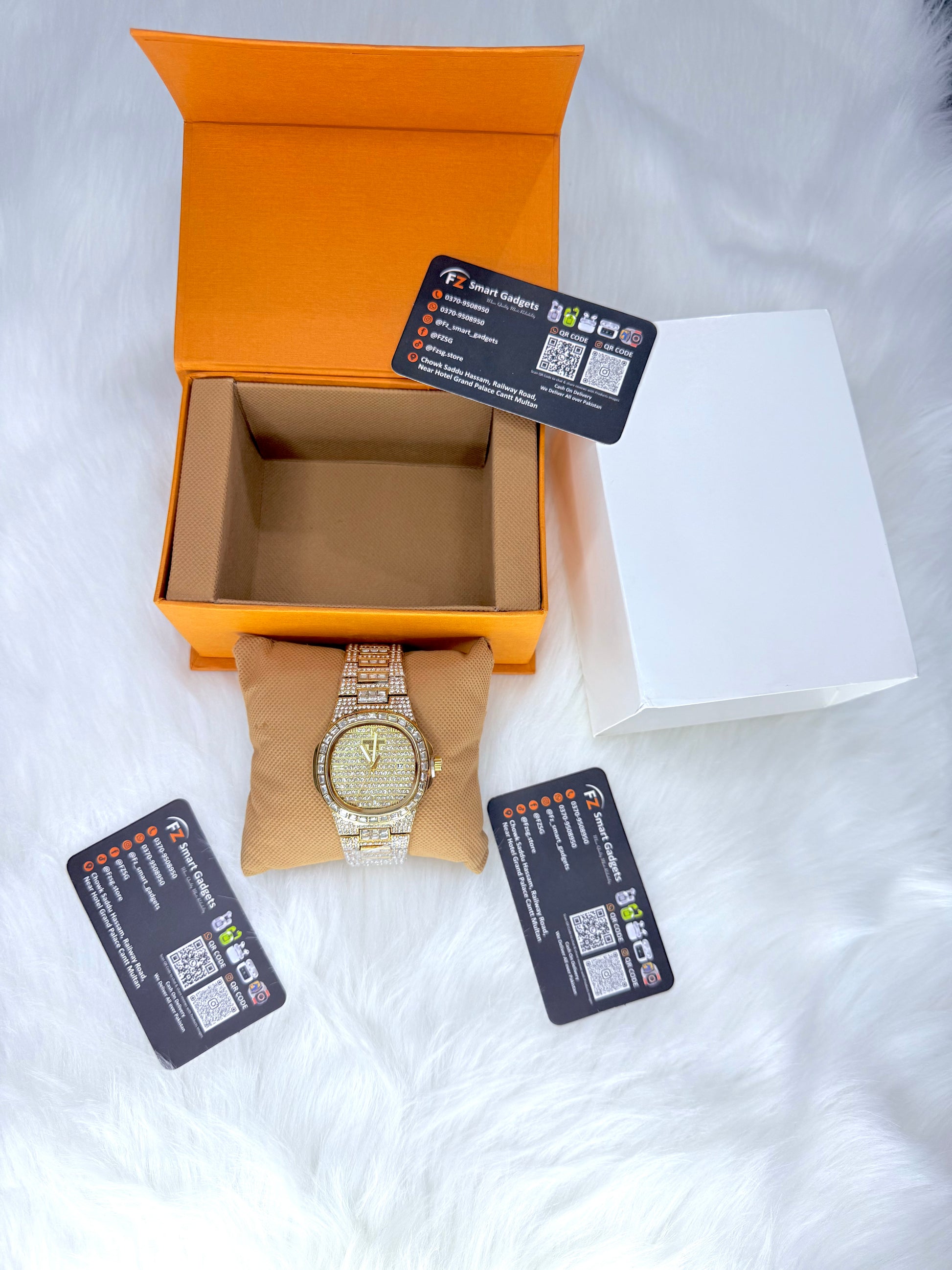 Patek Philippe iced out watch in gold with diamond-encrusted bracelet